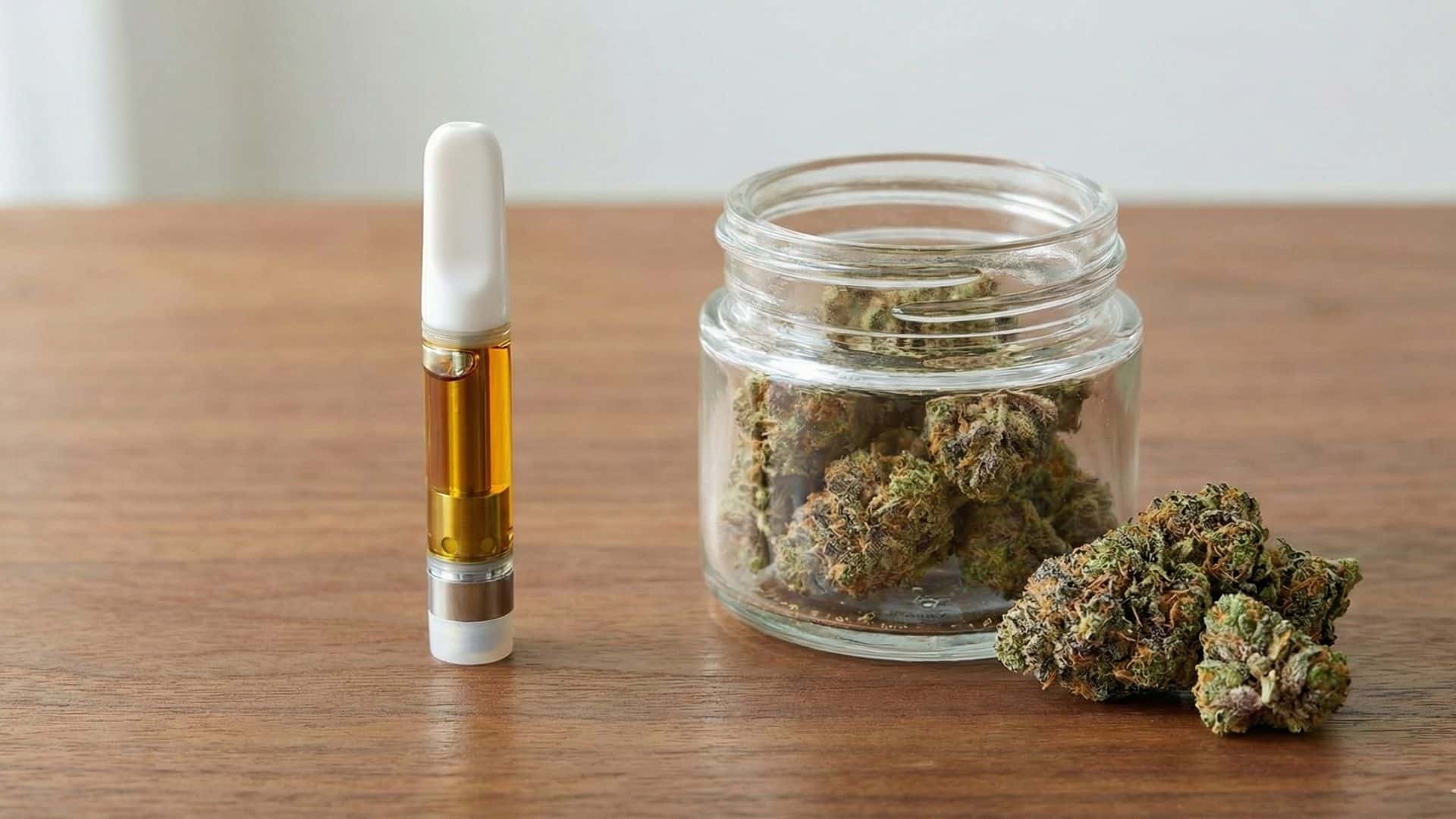 Green Crack strain flower and vape cartridge displayed together, commonly used to represent the strain’s energizing effects