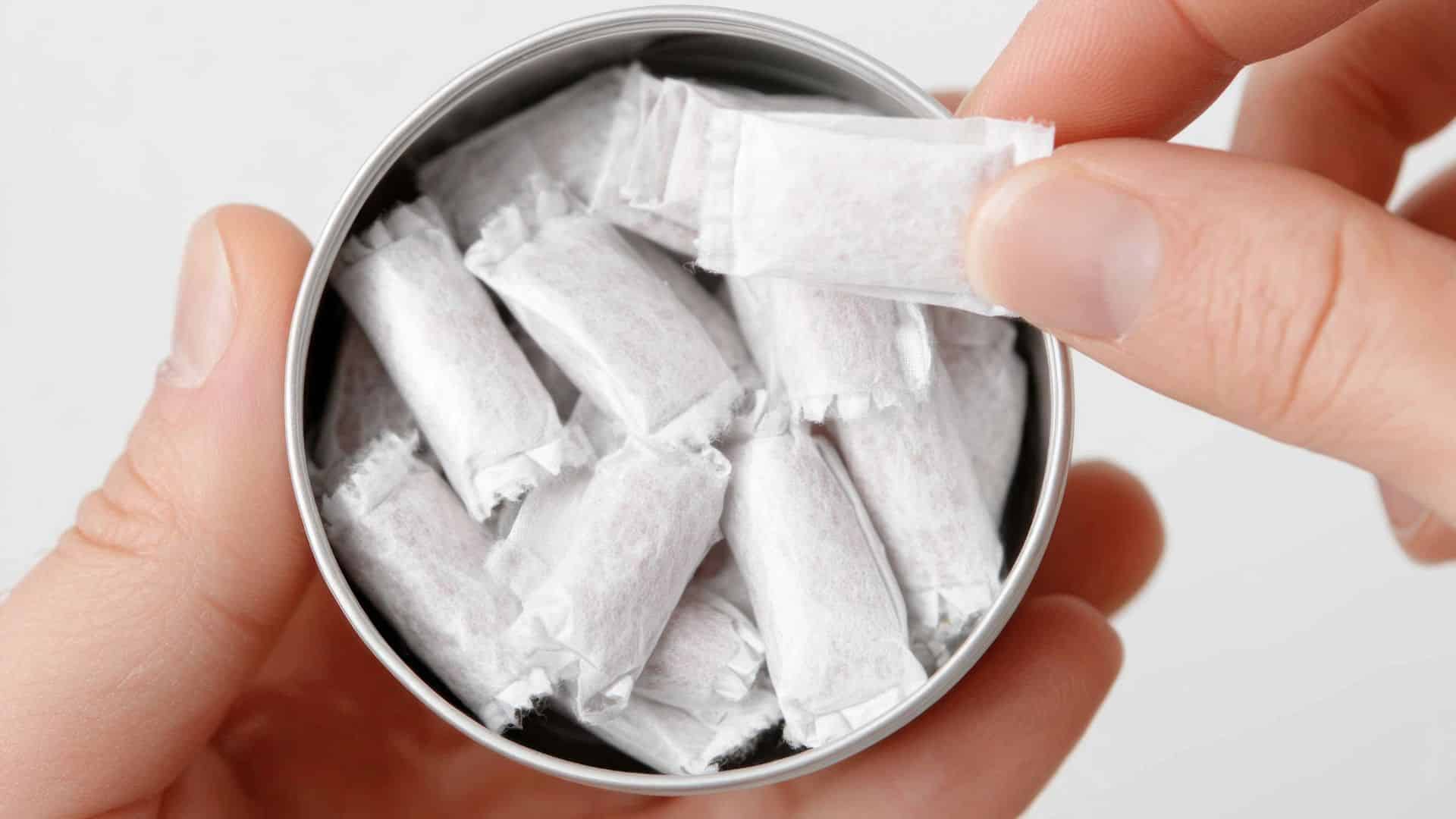 Small pouch-style packets in a container, used as a neutral visual alongside informational content about shatter THC