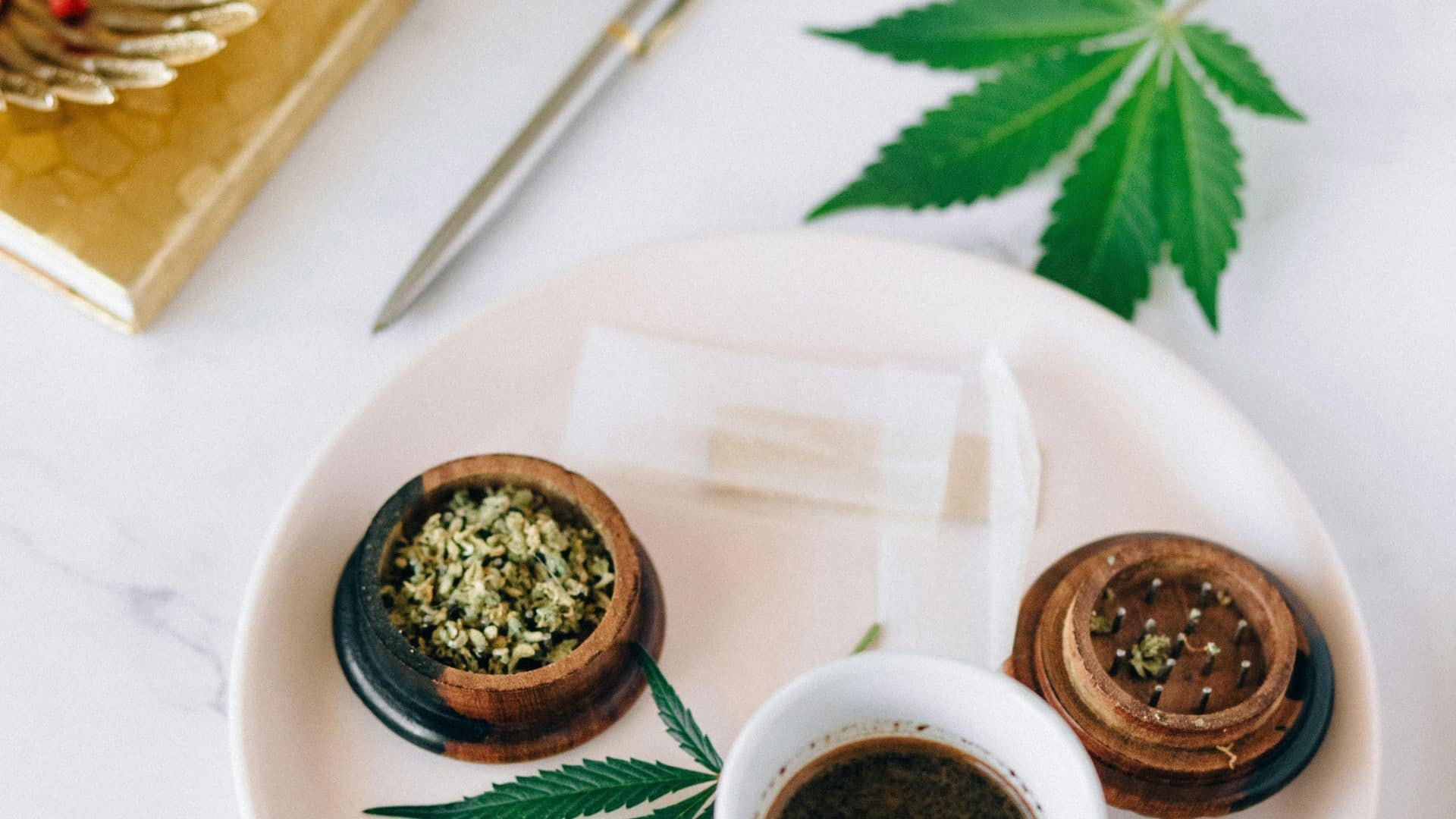 Cannabis accessories and flower displayed on a tray, supporting educational content explaining what is shatter and how it’s used.